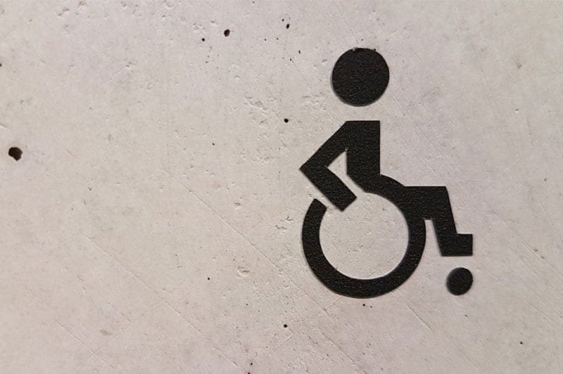 wheelchair icon painted on a wall